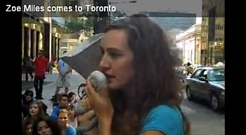 Zoe Miles speaking to a crowd of support during an Avatar flash mob in downtown Toronto to help protect BC's endangered ancient forests.